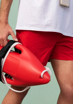 side-view-lifeguard-holding-lifesaving-buoy
