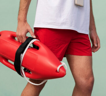side-view-lifeguard-holding-lifesaving-buoy